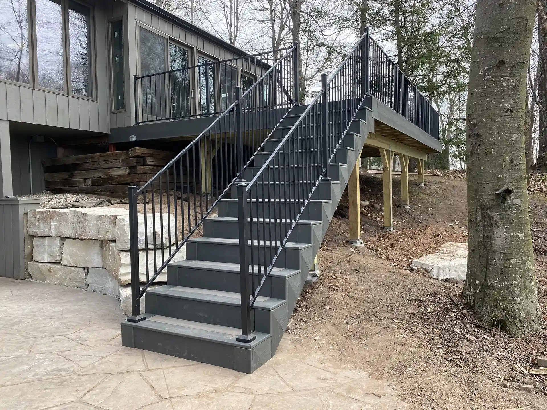 photo of elevated deck with deck railing and deck steps